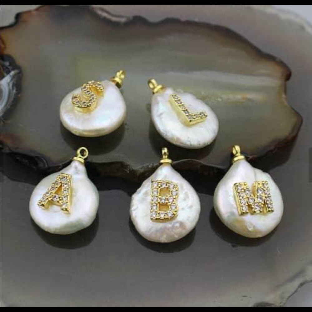 Fresh water pearl initials set gold plated.